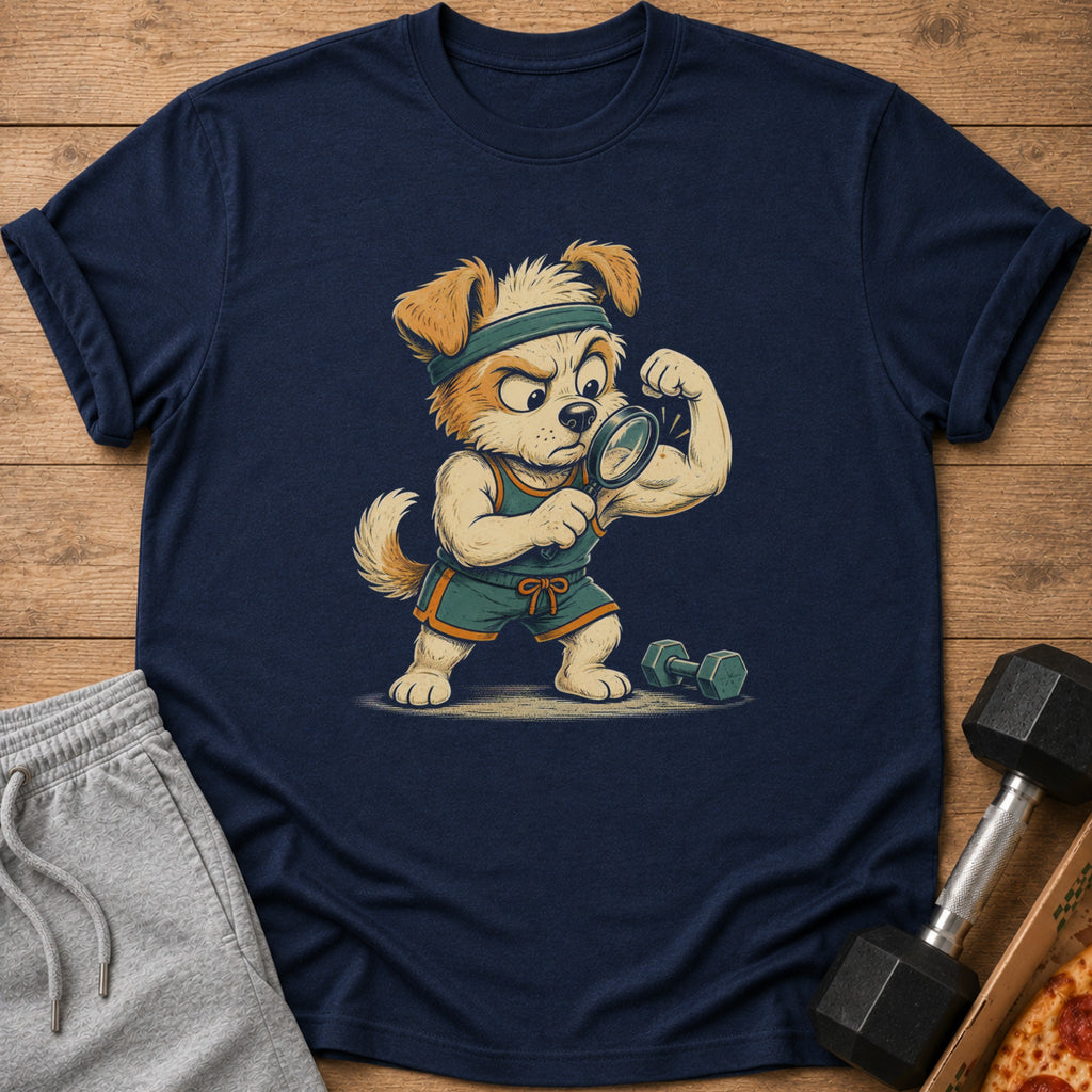 Navy t-shirt with cartoon dog examining bicep with magnifying glass.