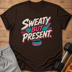 Brown t-shirt with "Sweaty But Present" graphic and a teal and pink design.