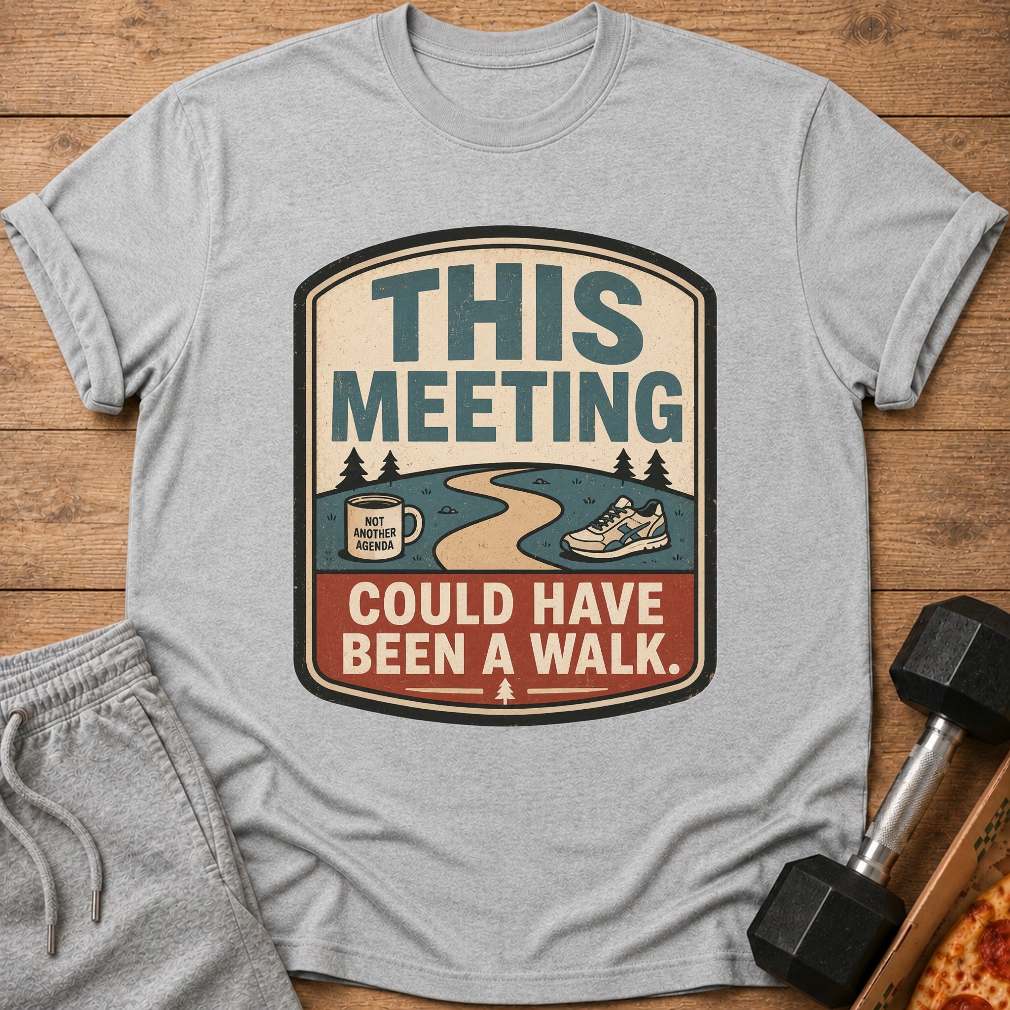 Grey t-shirt with "This meeting could have been a walk" text and graphics.