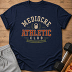 Navy t-shirt with "Mediocre Athletic Club Proudly Below Average" text and graphics.