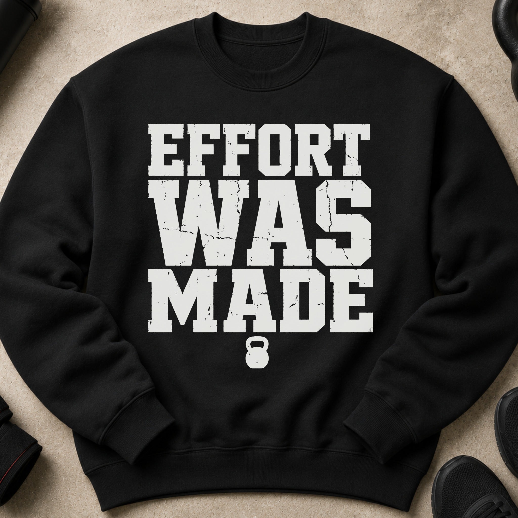 Black sweatshirt with white text "EFFORT WAS MADE" and a kettlebell graphic.