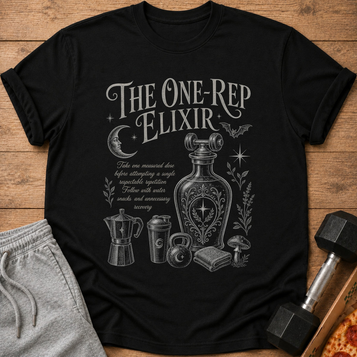 Black t-shirt with "The One-Rep Elixir" text and fitness-themed graphic.
