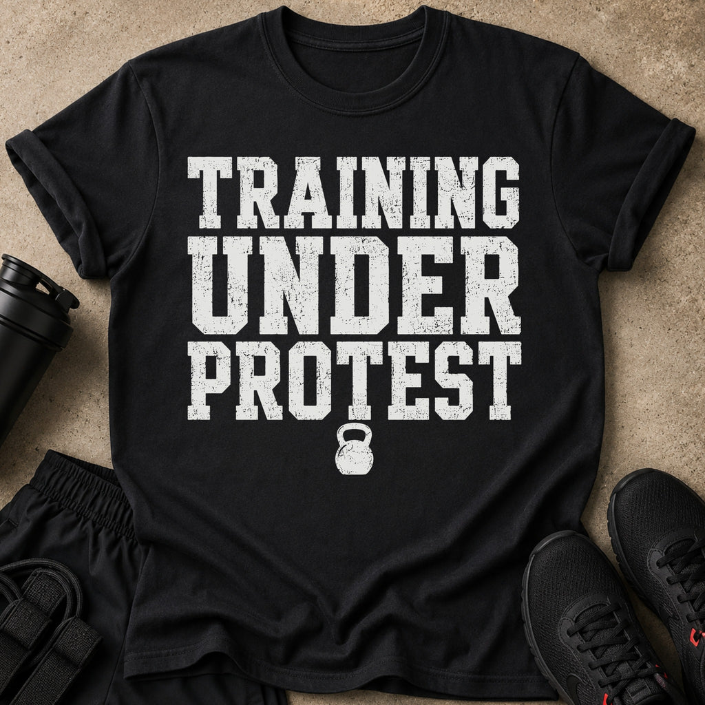 Black t-shirt with white text "TRAINING UNDER PROTEST" and a kettlebell icon.