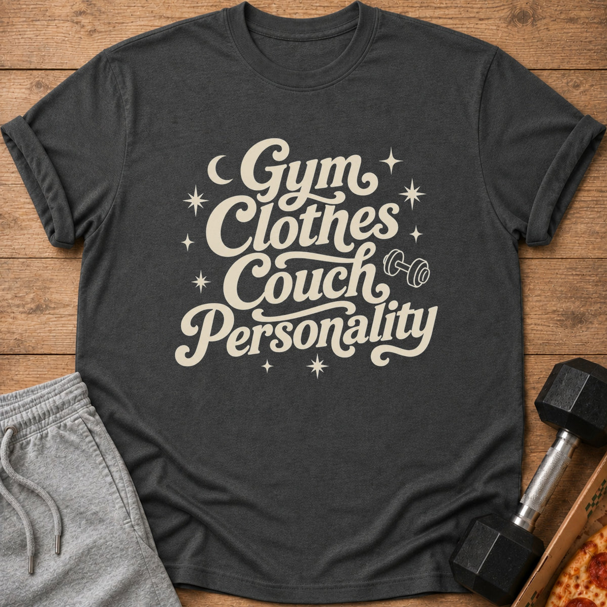 Dark grey t-shirt with text "Gym Clothes Couch Personality" and a dumbbell.