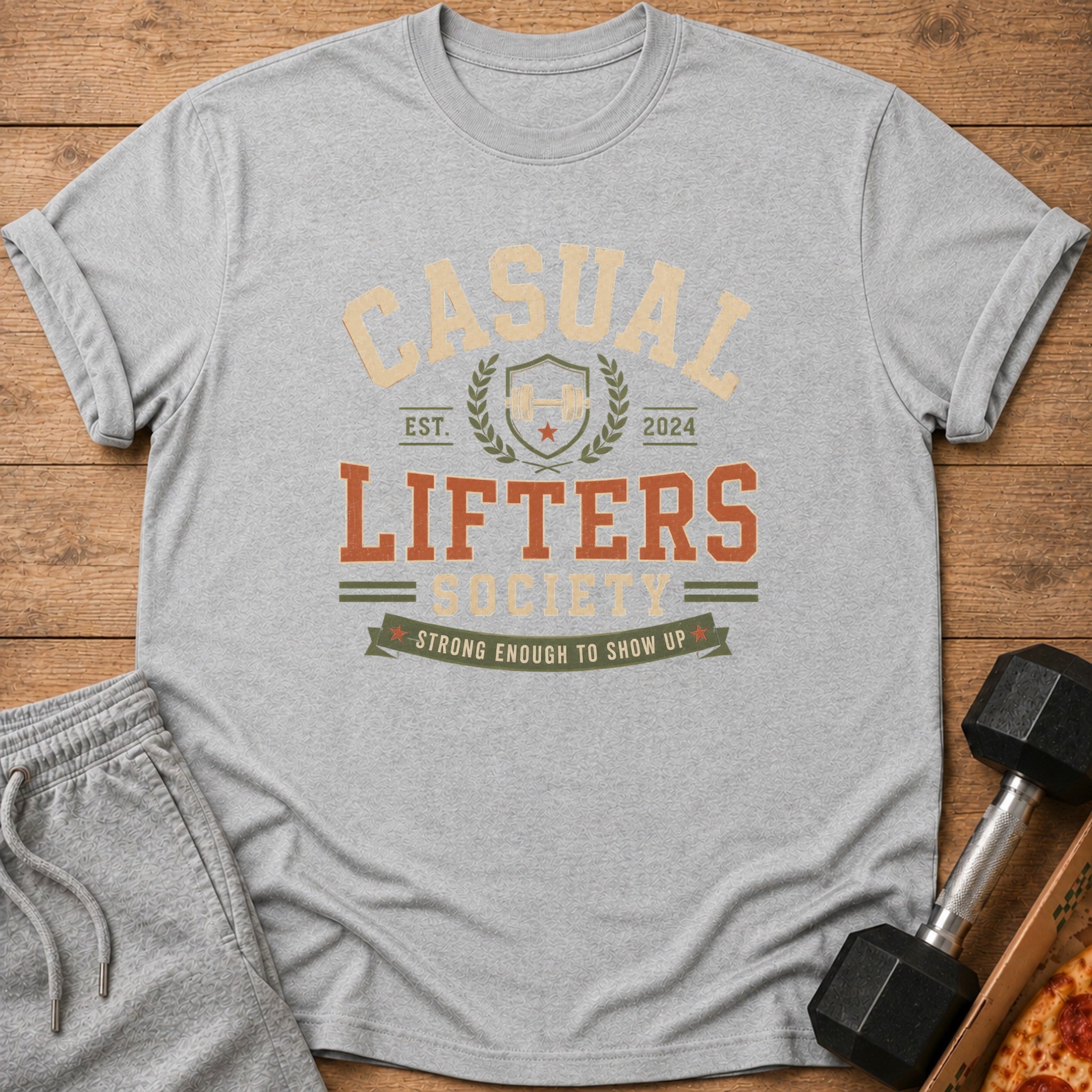 Grey t-shirt with "CASUAL LIFTERS SOCIETY" and "STRONG ENOUGH TO SHOW UP" graphic.