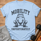 Light blue t-shirt with a distressed graphic of a frog holding dumbbells and the text "MOBILITY UNFORTUNATELY."