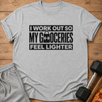 Grey t-shirt with "I WORK OUT SO MY GROCERIES FEEL LIGHTER" text and a dumbbell.