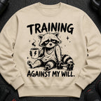 Sad raccoon in gym clothes holding coffee, "TRAINING AGAINST MY WILL." slogan.
