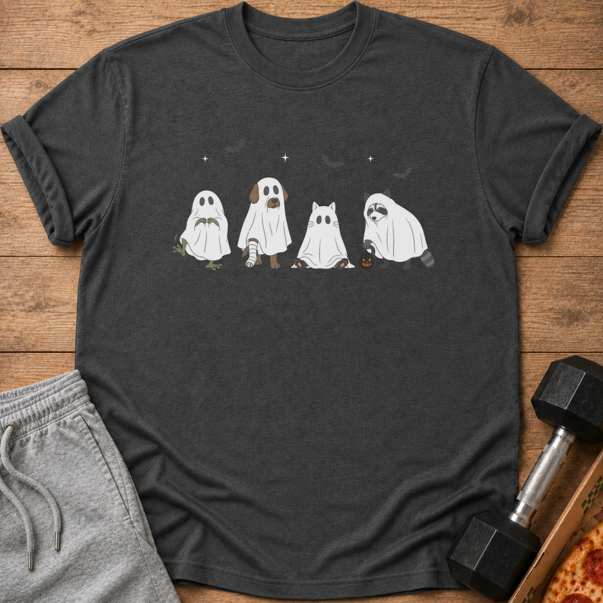 Dark grey t-shirt with cartoon ghosts of animals and Halloween motifs.