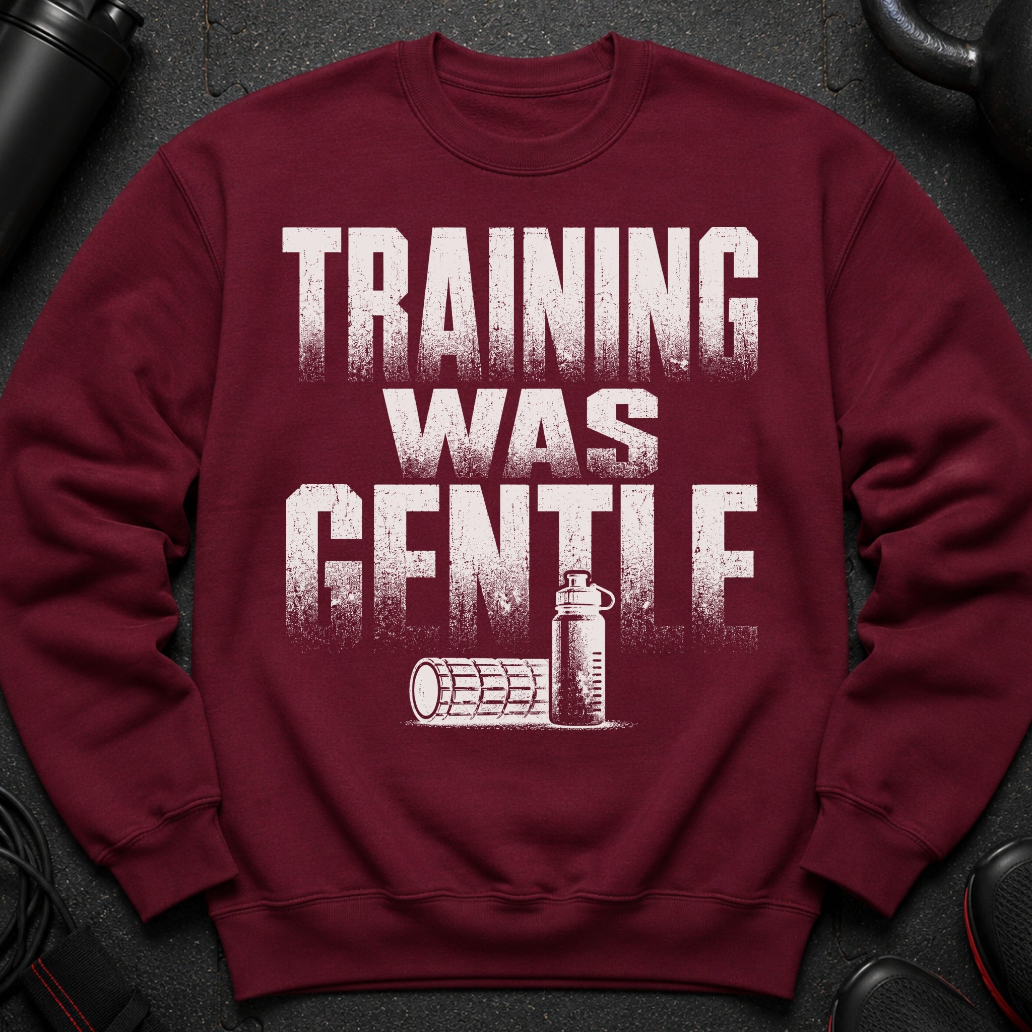Maroon sweatshirt with distressed white text "TRAINING WAS GENTLE" and illustrations.
