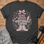 Dark gray t-shirt with "CUTE OUTFIT. QUESTIONABLE CARDIO." text and gym graphics.