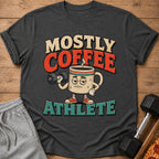 T-shirt with cartoon coffee mug lifting dumbbell, text says "Mostly Coffee Athlete".