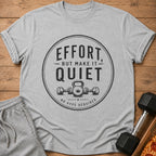 Grey t-shirt with "Effort, but make it quiet. No hype required" text and gym illustration.