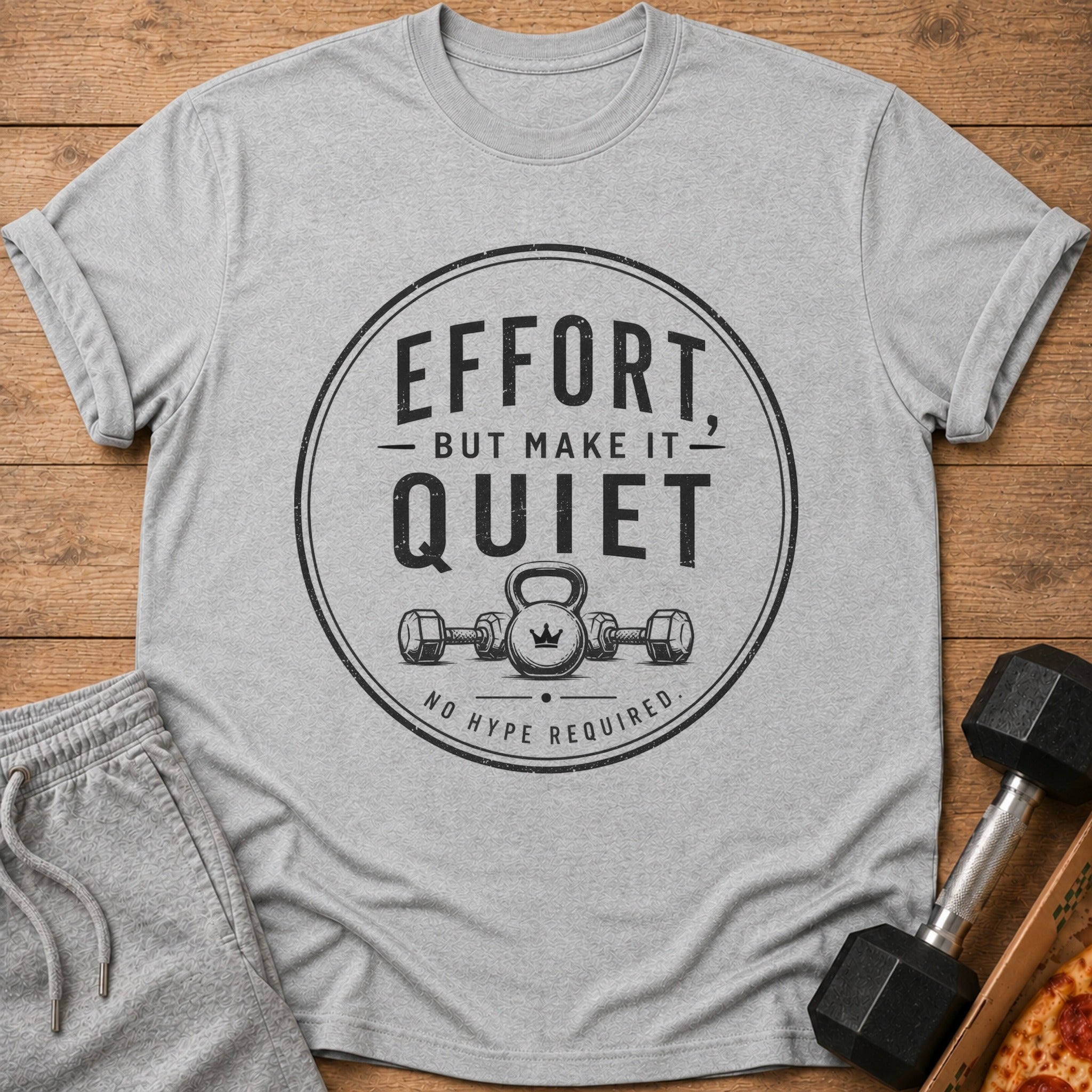 Grey t-shirt with "Effort, but make it quiet. No hype required" text and gym illustration.