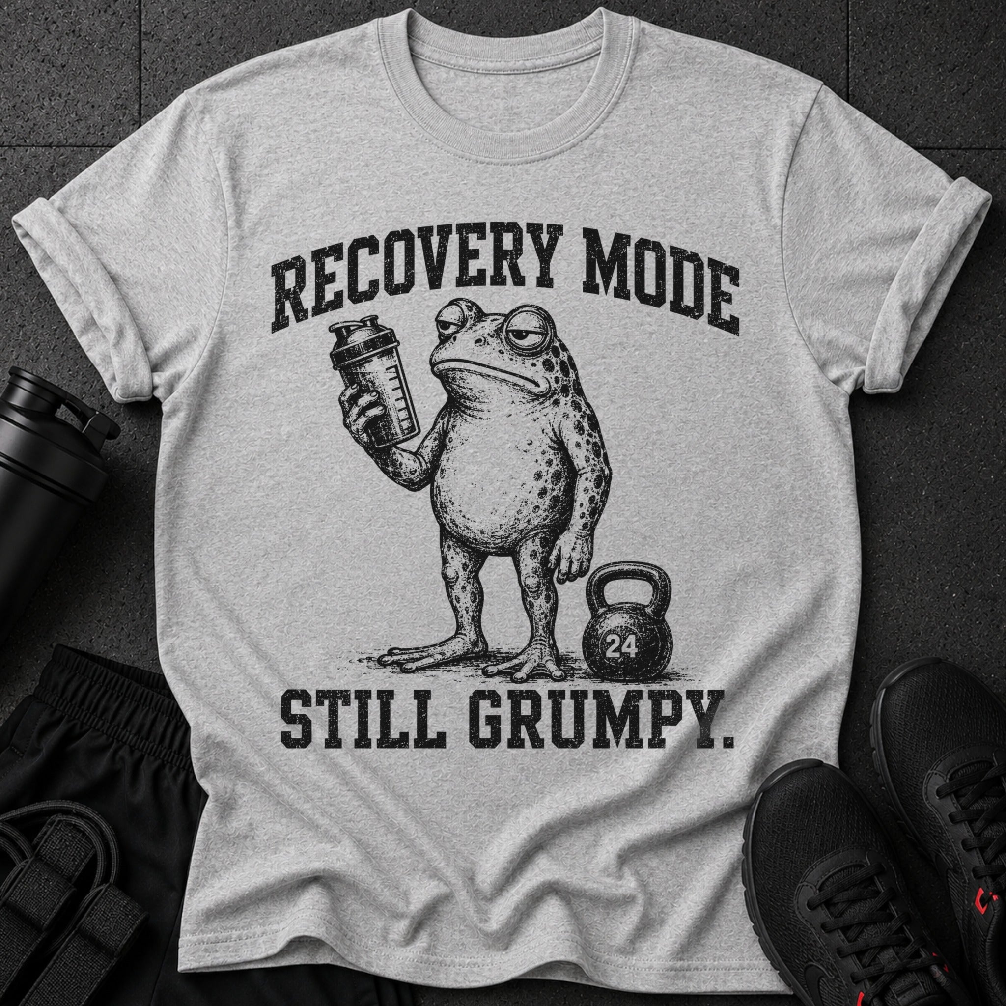 Grumpy frog with shaker and kettlebell, "RECOVERY MODE STILL GRUMPY."
