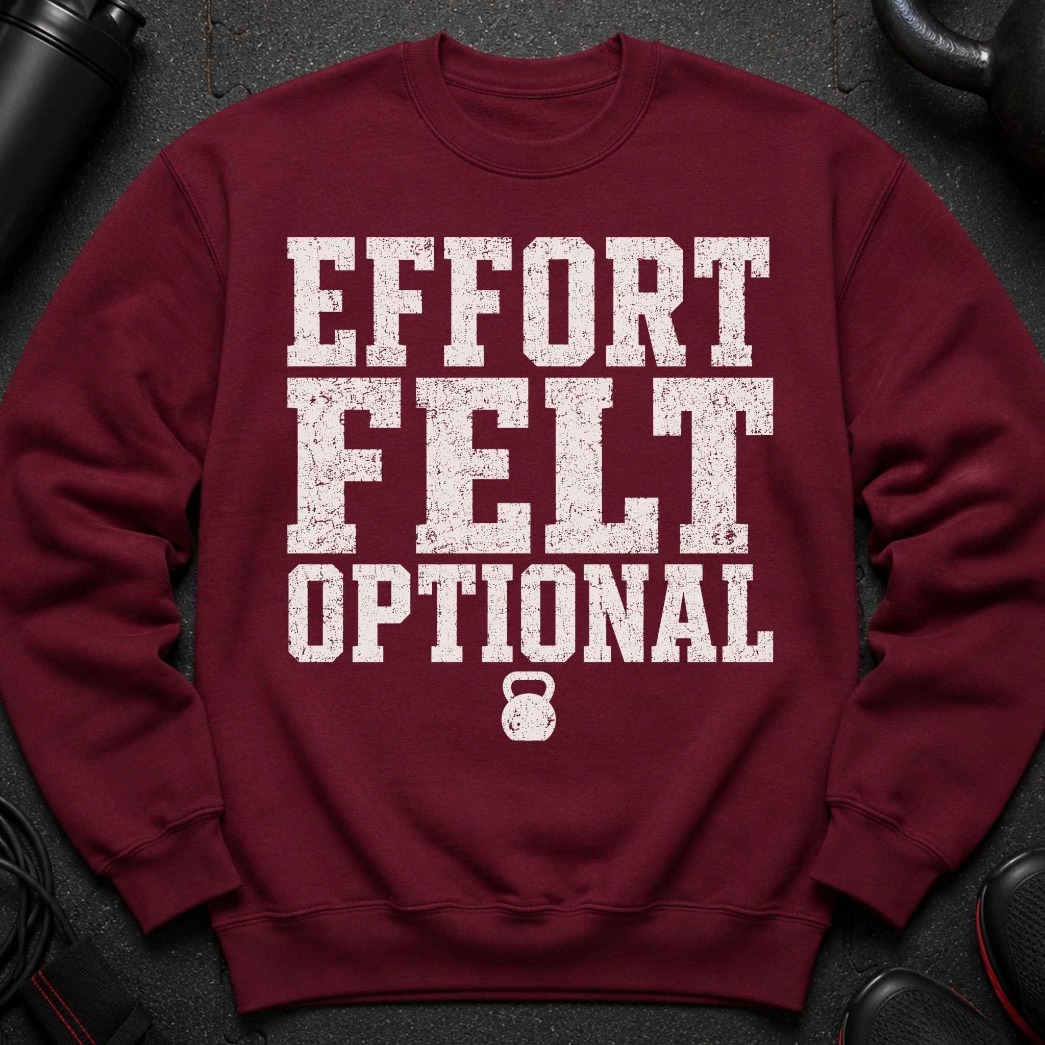 Maroon sweatshirt with "EFFORT FELT OPTIONAL" text and a kettlebell graphic.