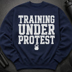 Navy sweatshirt with "TRAINING UNDER PROTEST" text and a kettlebell graphic.