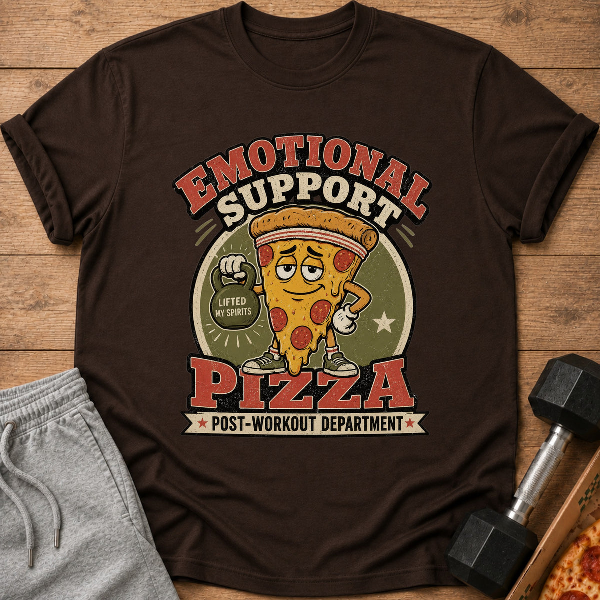 Brown t-shirt with graphic reading "Emotional Support Pizza Post-Workout Department".