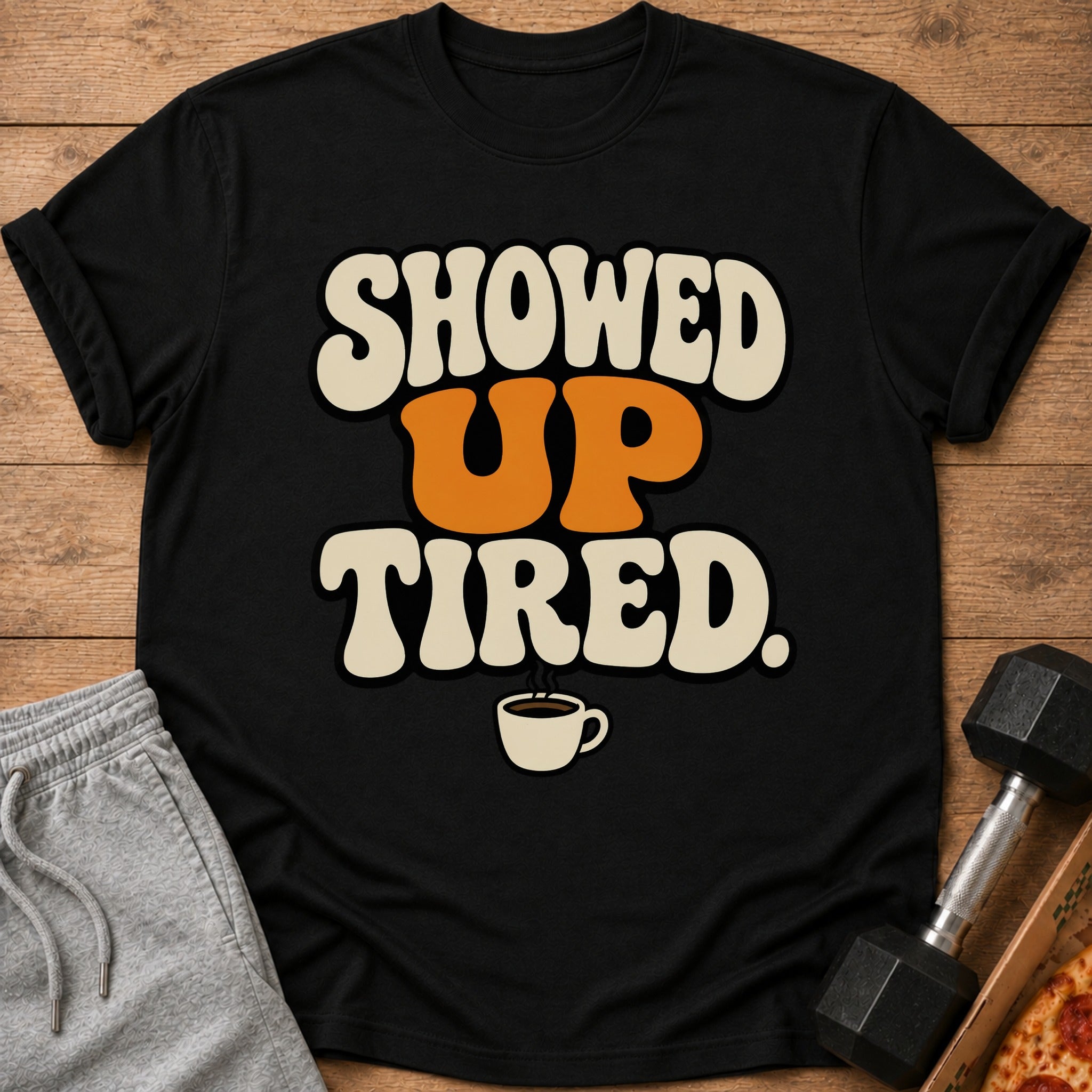Black t-shirt with "SHOWED UP TIRED." text and a coffee cup graphic.