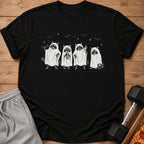 Four raccoons in ghost costumes with weights and a drink.
