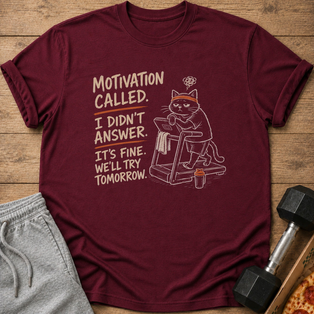 Maroon t-shirt with cartoon cat on treadmill and text "Motivation called. I didn't answer. It's fine. We'll try tomorrow."