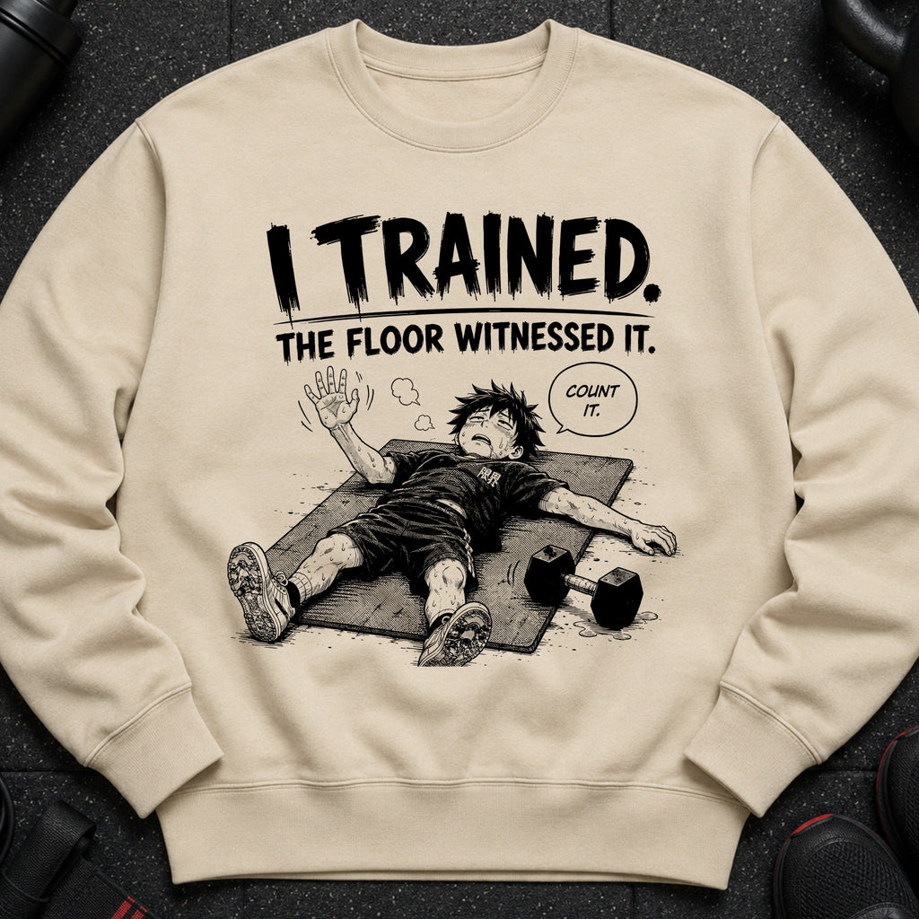 Light tan sweatshirt with black text "I TRAINED. THE FLOOR WITNESSED IT." and cartoon of exhausted person.