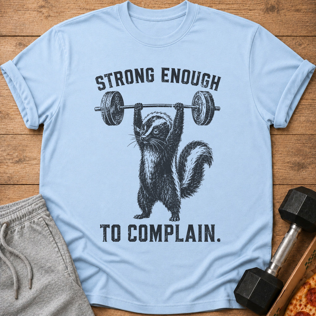 Light blue t-shirt with a skunk lifting a barbell and text "STRONG ENOUGH TO COMPLAIN."