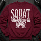 Maroon sweatshirt with distressed white "SQUAT" text and Bigfoot lifting weights graphic.