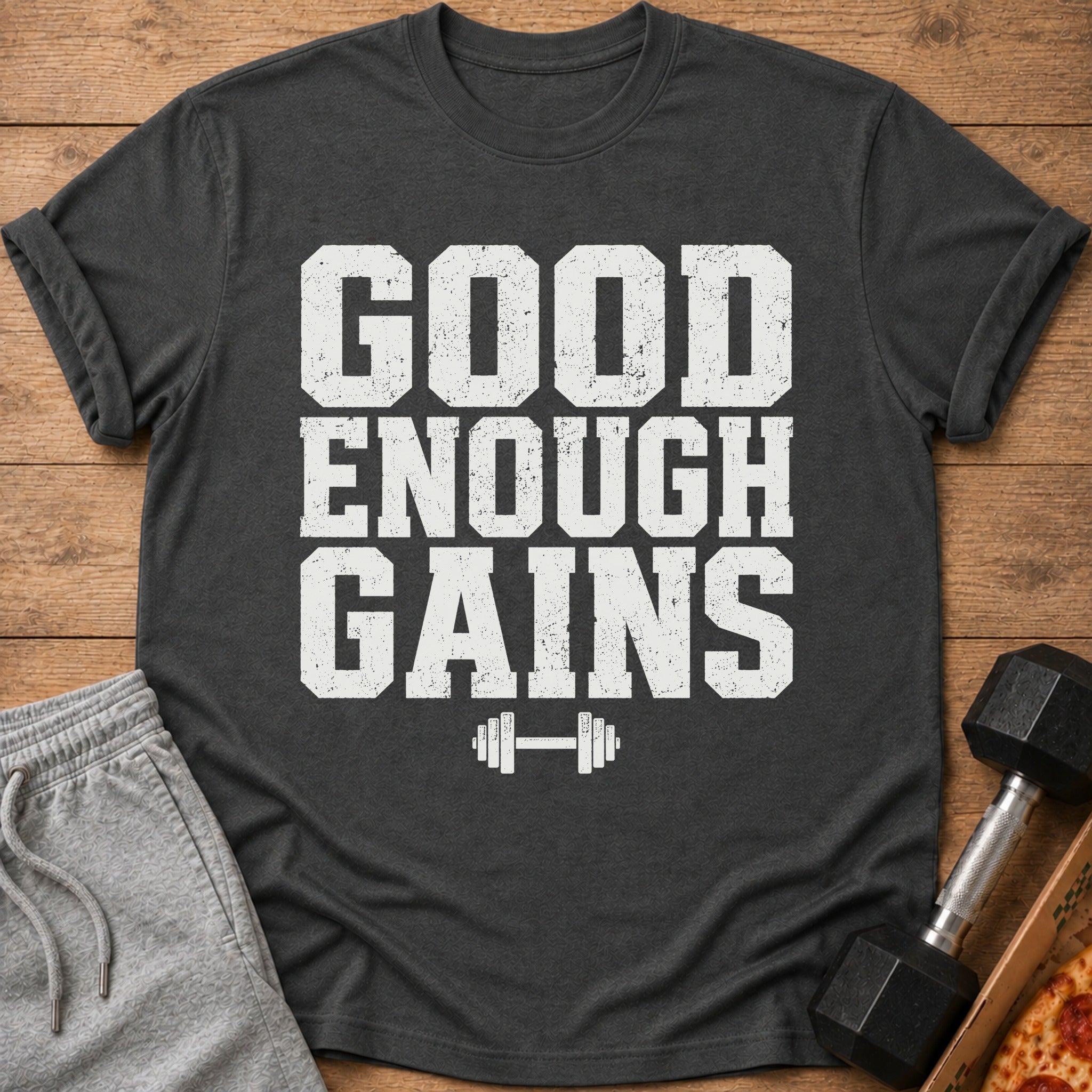 Dark gray t-shirt with "GOOD ENOUGH GAINS" and barbell graphic.