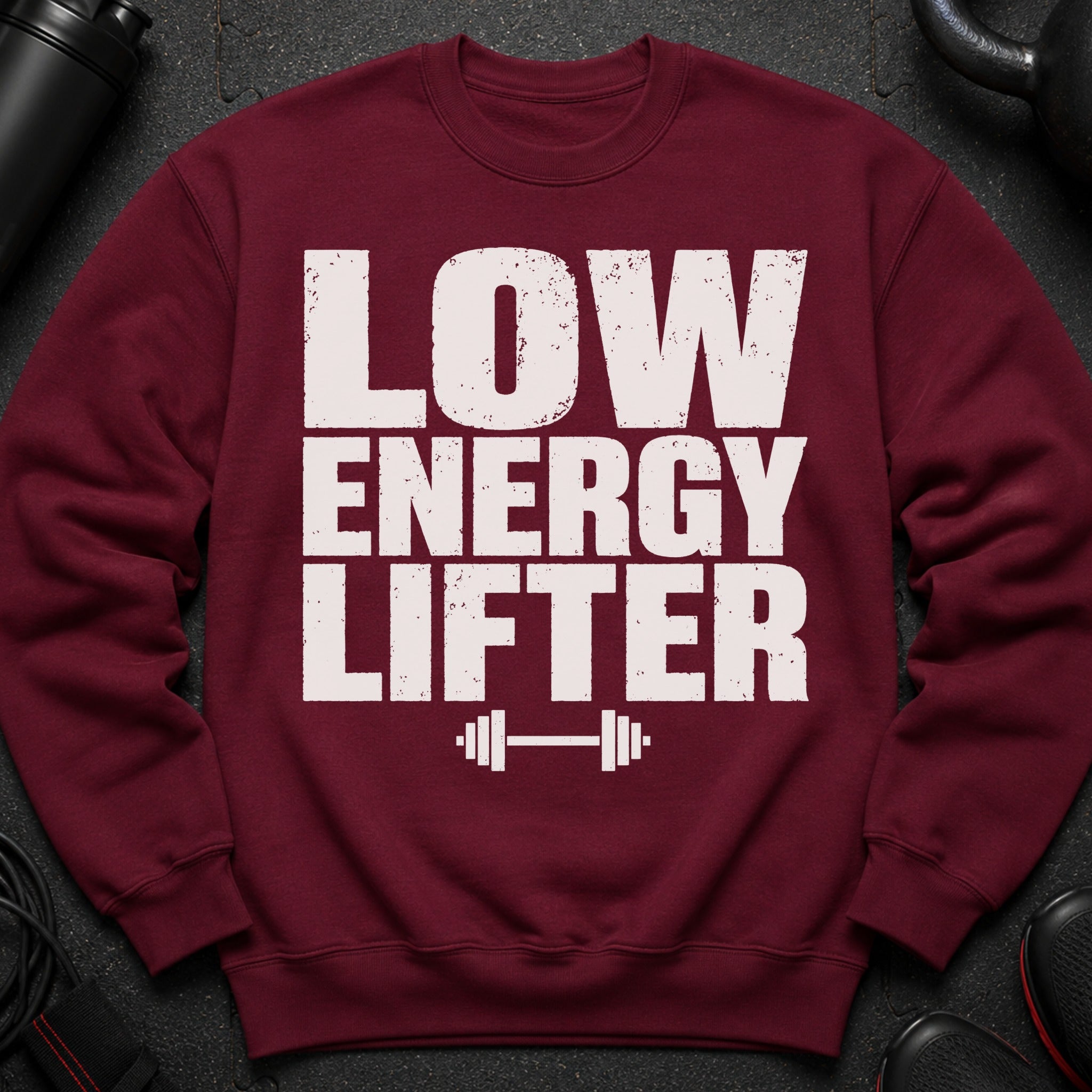 Maroon sweatshirt with white text reading "LOW ENERGY LIFTER" and a dumbbell graphic.