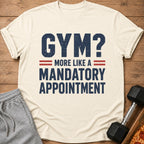 Cream t-shirt with text "GYM? MORE LIKE A MANDATORY APPOINTMENT".