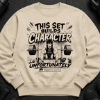 Crewneck sweatshirt with "This set builds character" and anime weightlifter artwork.