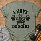 Green t-shirt with graphic of goat lifting barbell, text "I HAVE ONE GOOD SET".