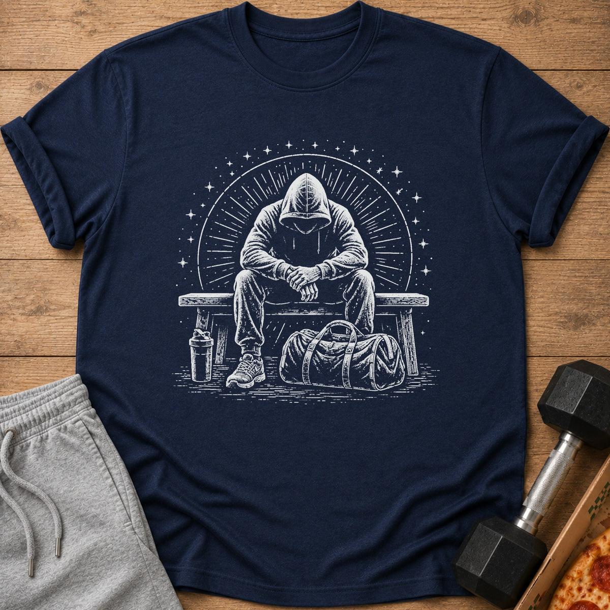 Navy t-shirt with a sketch of a person in a hoodie sitting with a gym bag and shaker bottle.