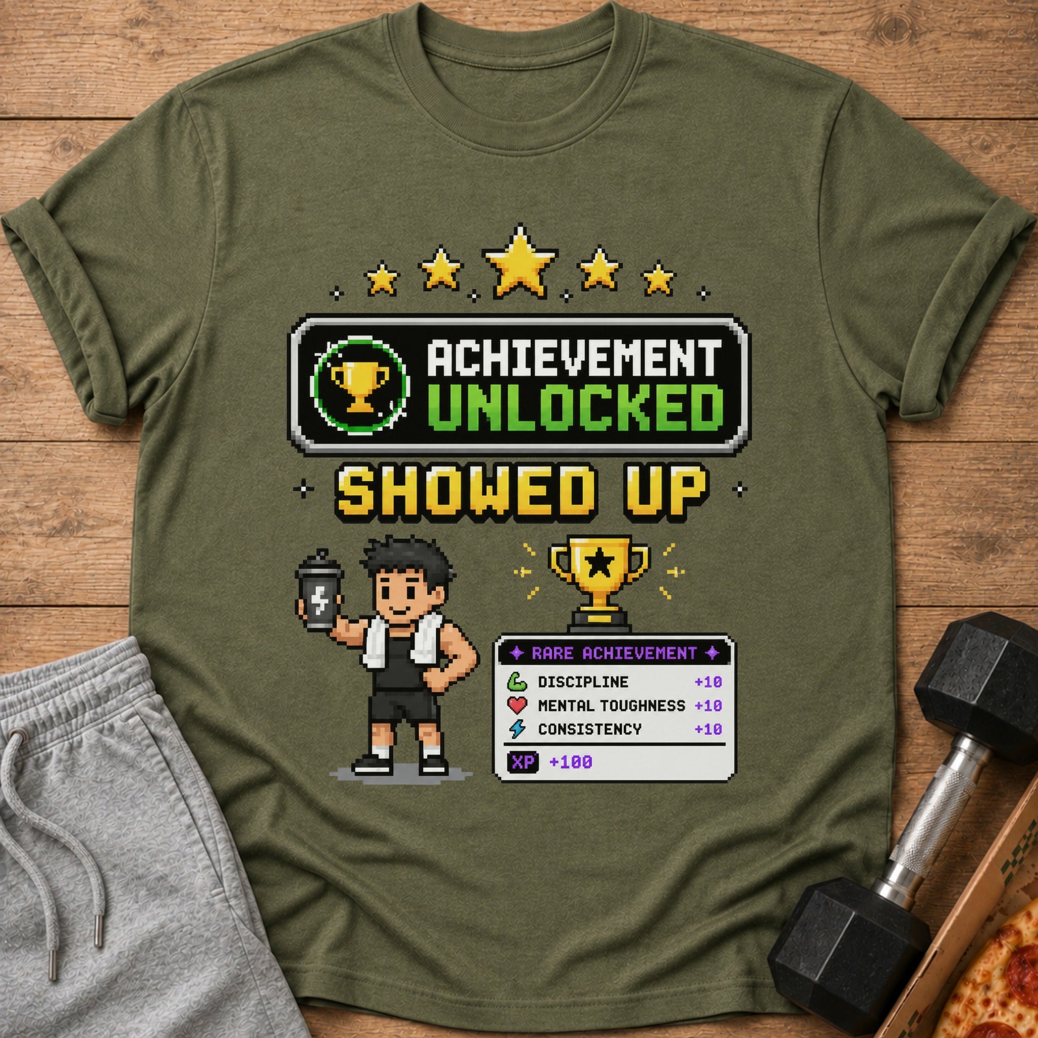 T-shirt graphic "Achievement Unlocked Showed Up" with pixelated gamer and stats.