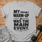 Grey t-shirt with black text: "MY WARM-UP WAS THE MAIN EVENT."