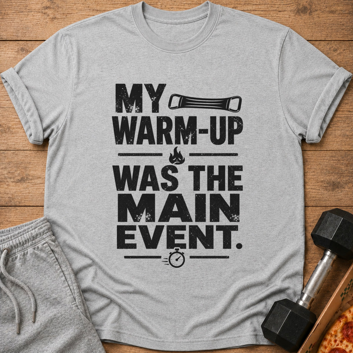 Grey t-shirt with black text: "MY WARM-UP WAS THE MAIN EVENT."