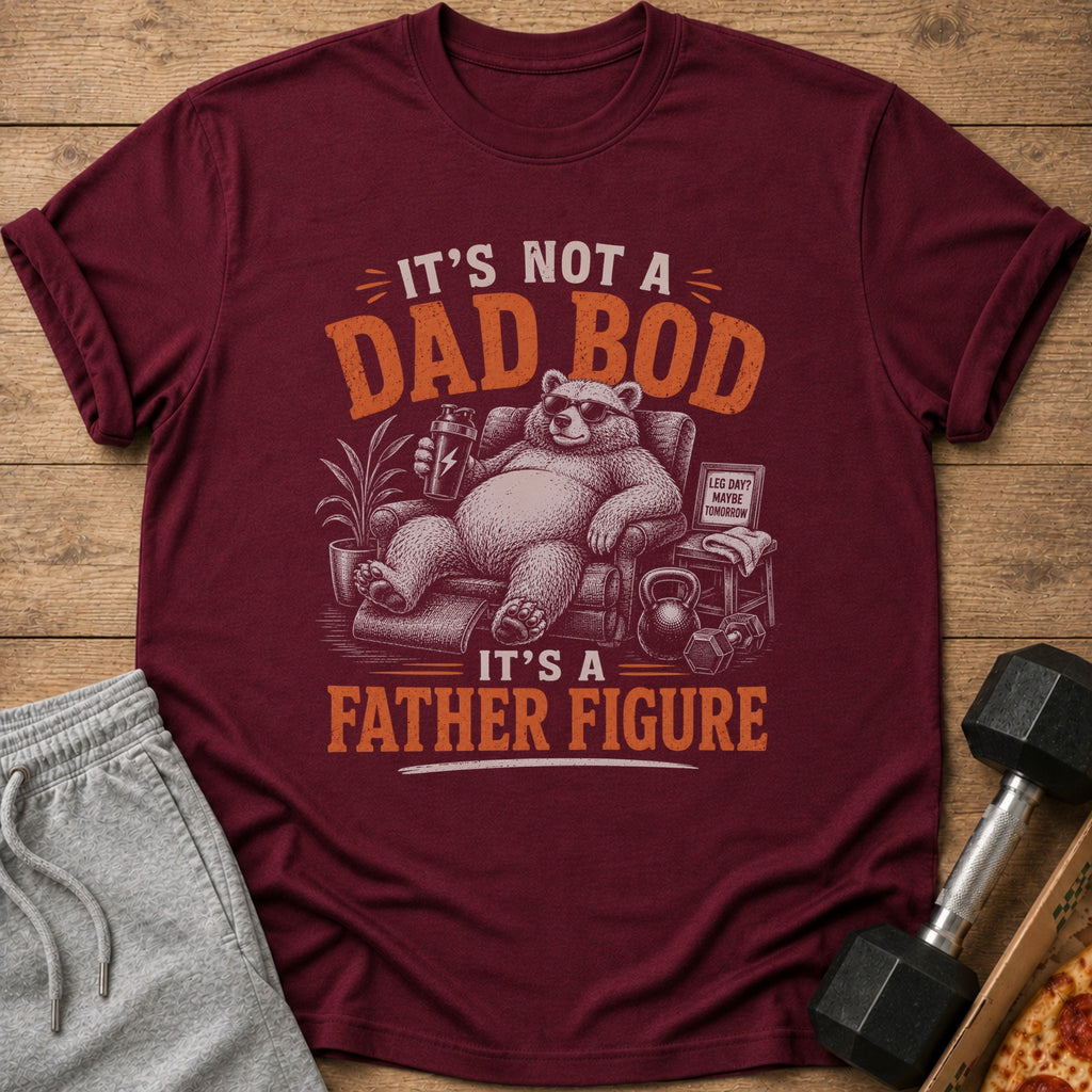 Maroon t-shirt with a bear on a couch holding a shaker, reading "It's Not a Dad Bod, It's a Father Figure."