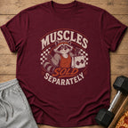 Maroon t-shirt with a raccoon graphic and the text "Muscles Sold Separately".