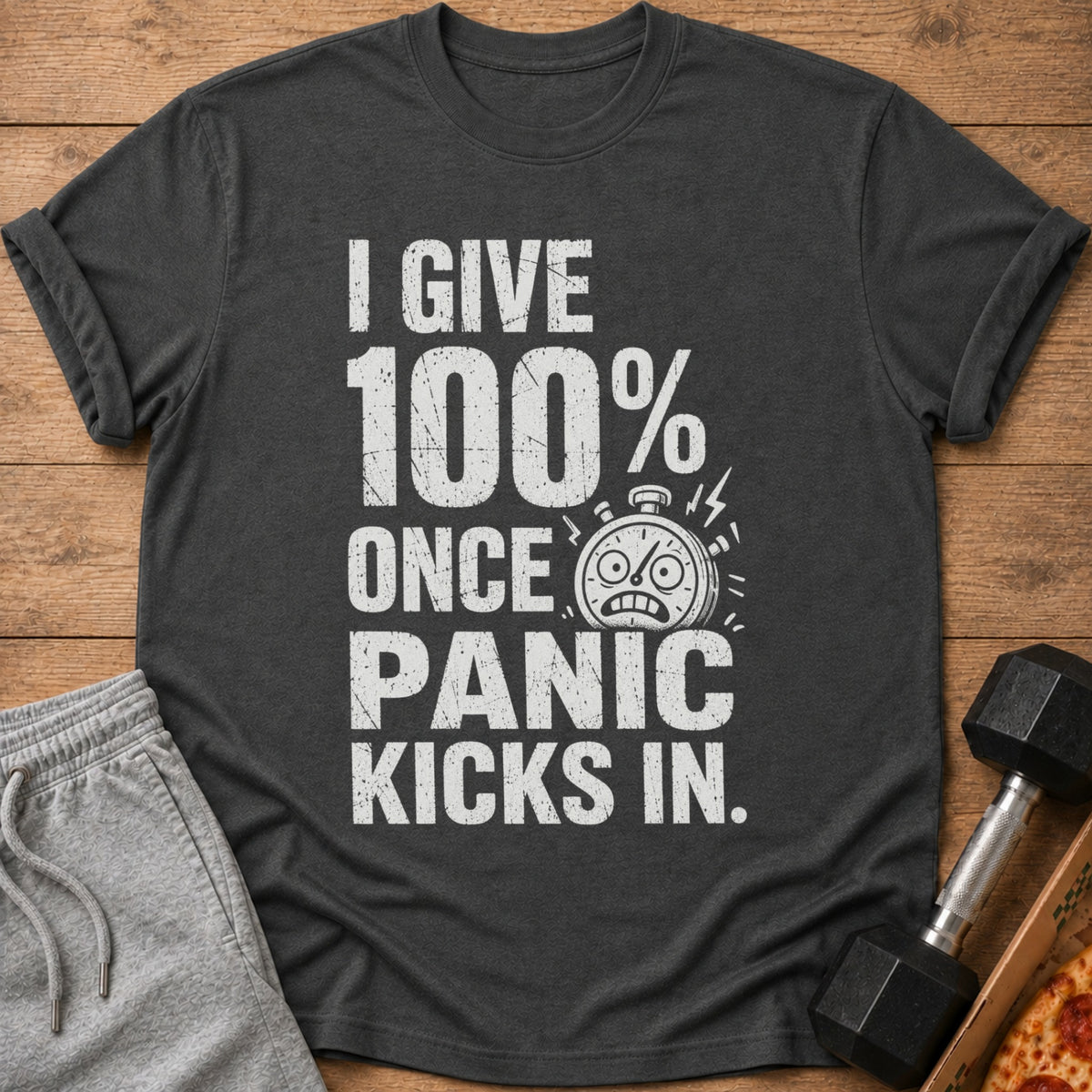 Dark gray t-shirt with white text: "I GIVE 100% ONCE PANIC KICKS IN."