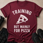 Maroon t-shirt with "TRAINING BUT MAINLY FOR PIZZA" text and pizza slice graphic.