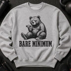 Grey sweatshirt featuring a bear sitting with a dumbbell and the text "BARE MINIMUM".