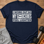 Navy t-shirt with white text: "I WORK OUT SO MY GROCERIES FEEL LIGHTER".