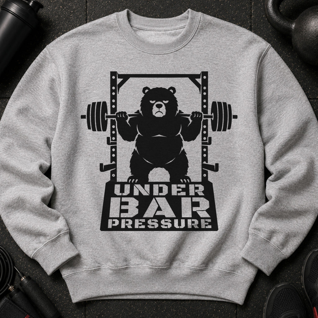 Black graphic of bear on barbell with text "UNDER BAR PRESSURE" on gray sweatshirt.