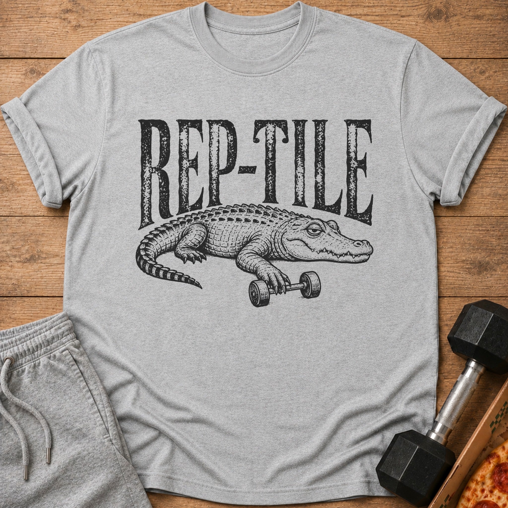 Grey t-shirt with "REP-TILE" text and an alligator lifting a dumbbell.