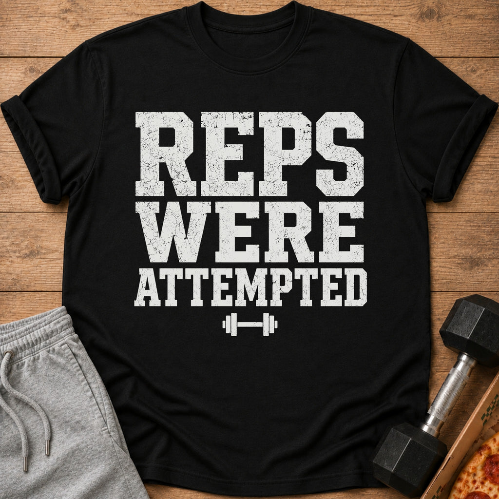 Black t-shirt with "REPS WERE ATTEMPTED" text and dumbbell graphic.