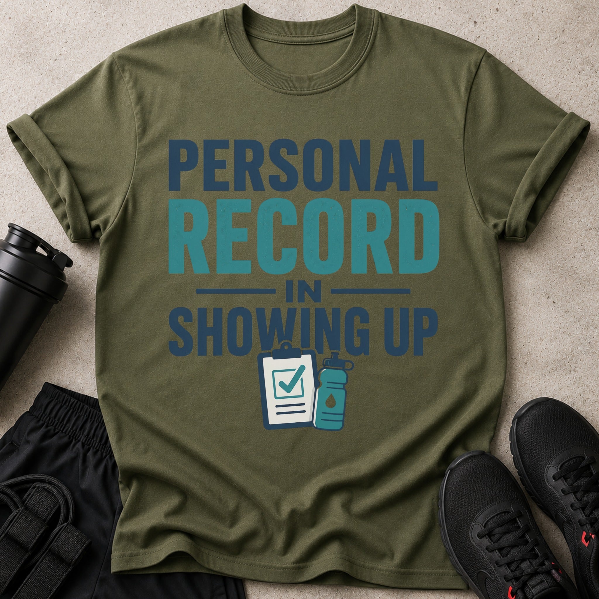 Olive green t-shirt with "PERSONAL RECORD IN SHOWING UP" text and fitness graphics.
