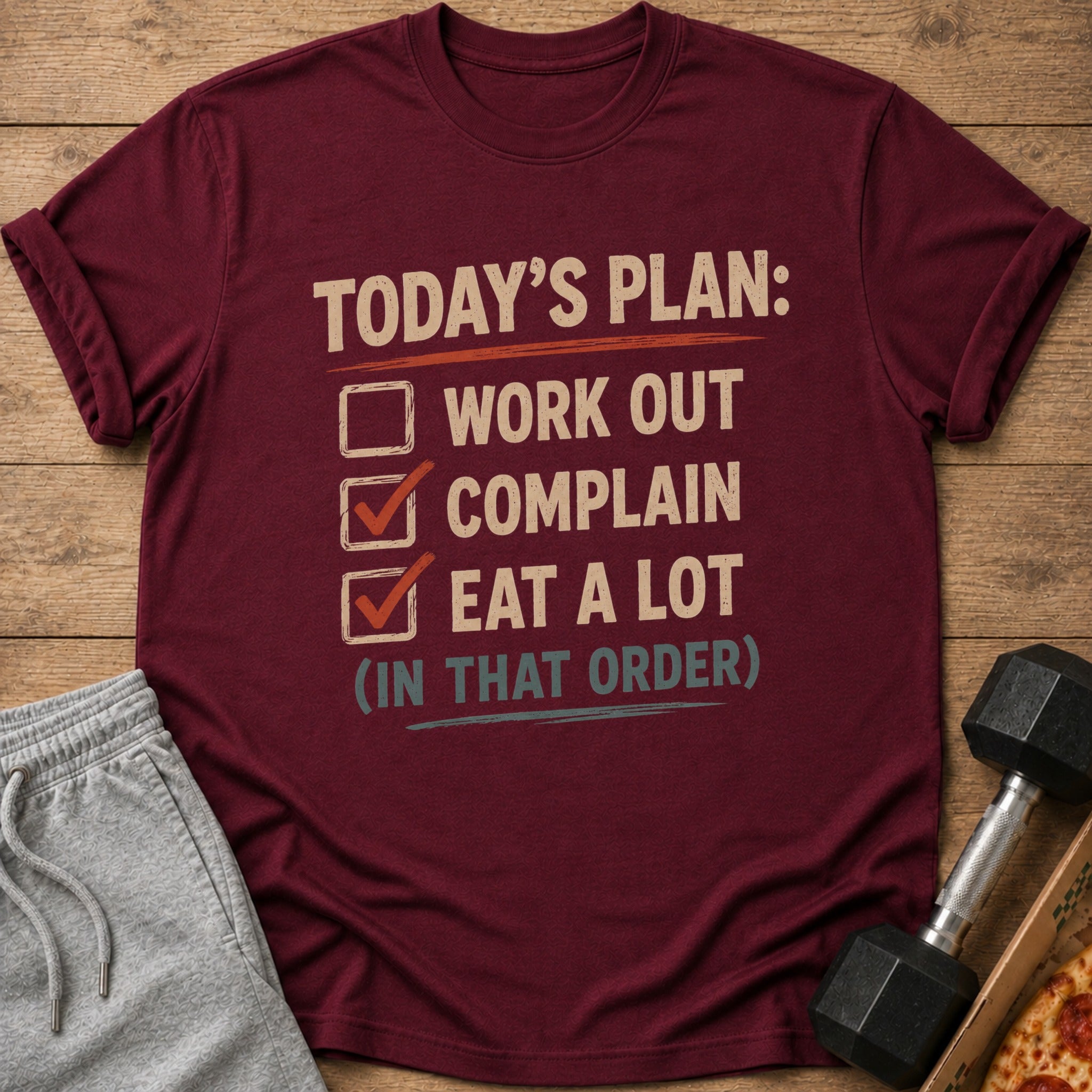 Maroon t-shirt with text "Today's Plan: Work Out, Complain, Eat A Lot (In That Order)".