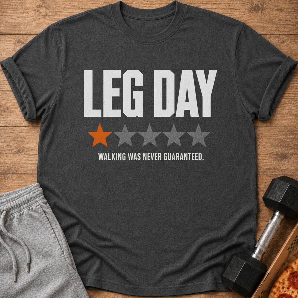 Charcoal t-shirt with "LEG DAY" text, one orange star, and "WALKING WAS NEVER GUARANTEED."