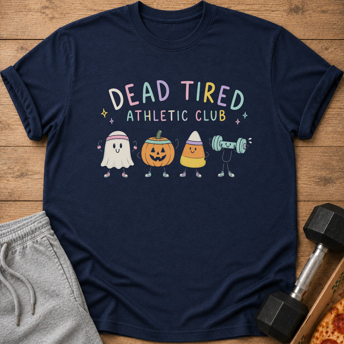 Dark blue t-shirt featuring a Dead Tired Athletic Club graphic with cute Halloween characters lifting weights.